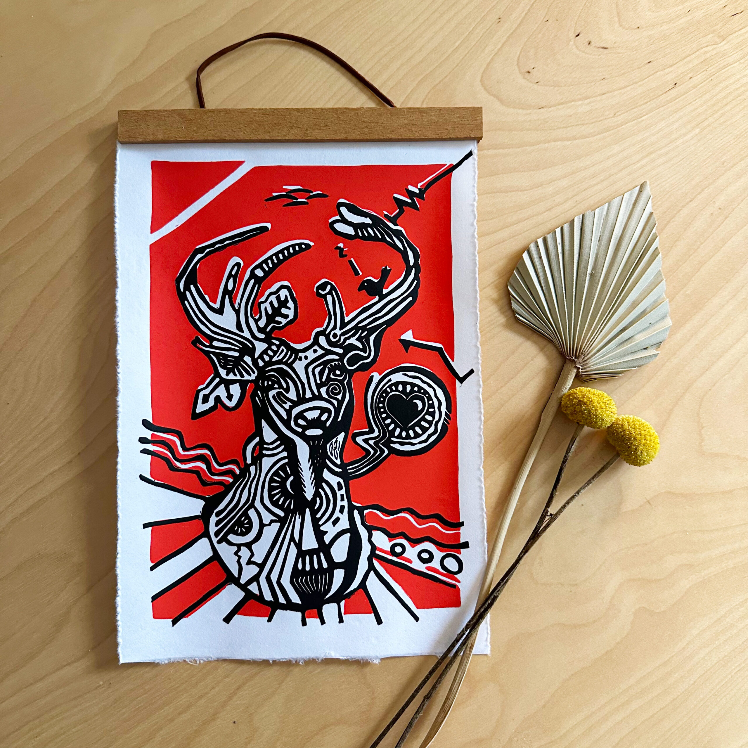 deer lino print on table