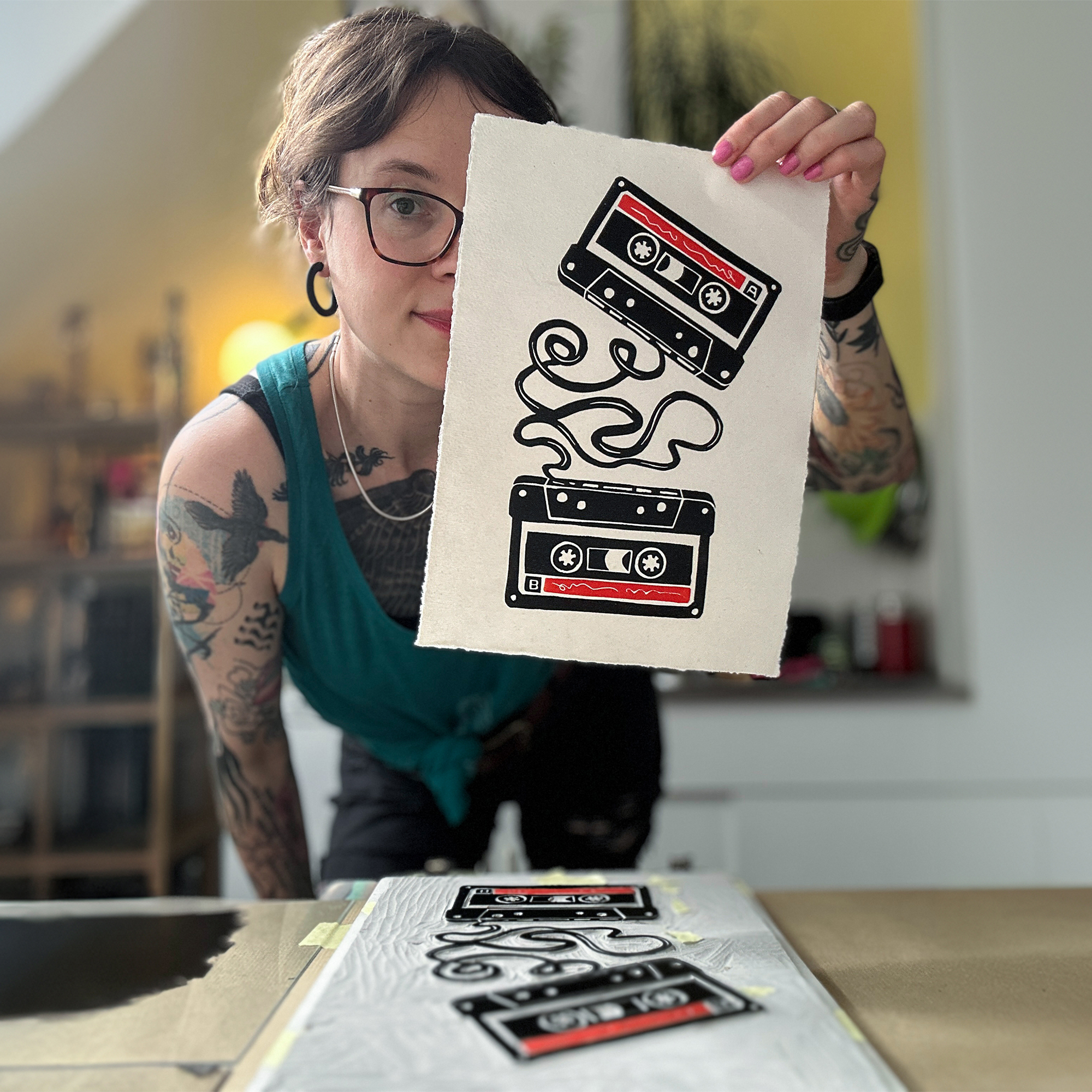 holding music tape lino print in my workspace