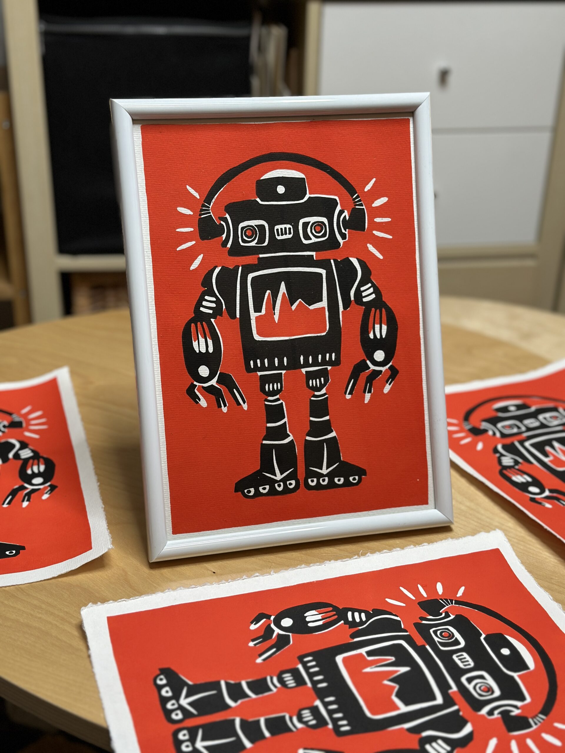 robot on rollerblades lino print framed