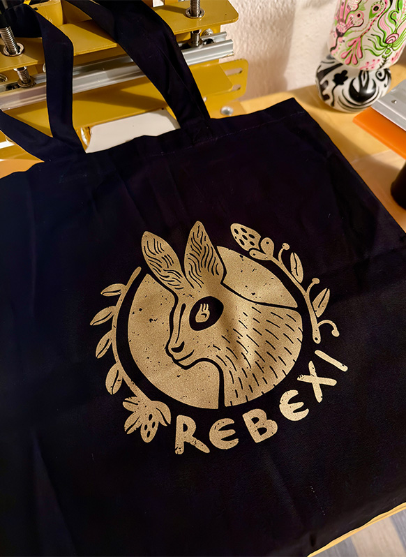 final gold pring on black tote bag